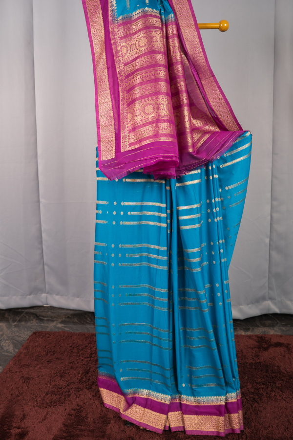 2D Pattern Semi Mysore Silk Crape With Golden Line All Over The Body - Sky Blue with Dark Pink